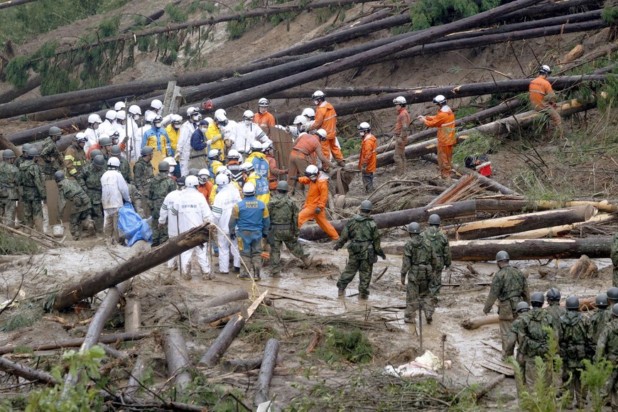 Rescue workers including Japanese Self-Defence Force soldiers conduct search and rescue operation at a landslide site caused by Typhoon Nanmadol in Mimata town, Miyazaki Prefecture on Japan's southernmost main island of Kyushu September 19, 2022, in this photo taken by Kyodo. Mandatory credit Kyodo via REUTERS ATTENTION EDITORS - THIS IMAGE WAS PROVIDED BY A THIRD PARTY. MANDATORY CREDIT. JAPAN OUT. NO COMMERCIAL OR EDITORIAL SALES IN JAPAN