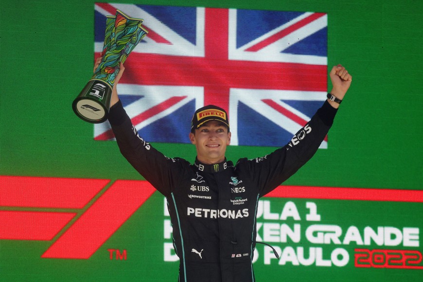 Formula One F1 - Brazilian Grand Prix - Jose Carlos Pace Circuit, Sao Paulo, Brazil - November 13, 2022
Mercedes' George Russell celebrates on the podium with the trophy after winning the race REUTERS/Ricardo Moraes