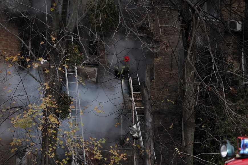 Firefighters work to put out a fire in a residential building hit by a Russian missile strike, amid Russia's attack on Ukraine, in Kyiv, Ukraine November 15, 2022. REUTERS/Gleb Garanich