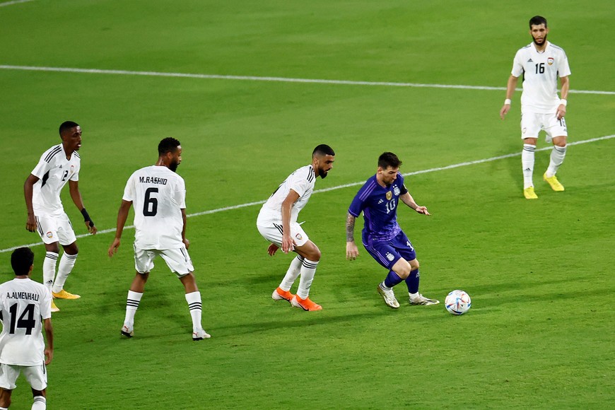 Soccer Football - International Friendly - United Arab Emirates v Argentina - Mohammed bin Zayed Stadium, Abu Dhabi, United Arab Emirates - November 16, 2022
Argentina's Lionel Messi in action with United Arab Emirates' Yahia Nader REUTERS/Rula Rouhana