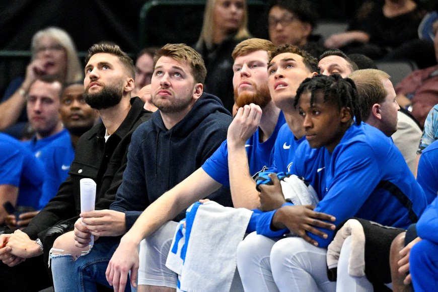 Nov 16, 2022; Dallas, Texas, USA; (from left) Dallas Mavericks forward Maxi Kleber and guard Luka Doncic sit on the Mavericks team bench during the second half against the Houston Rockets at the American Airlines Center. Mandatory Credit: Jerome Miron-USA TODAY Sports