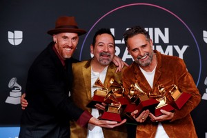 Jorge Drexler, Carles Campi Campon and Ernesto Garcia pose holding several awards in the photo room during the 23rd Annual Latin Grammy Awards show in Las Vegas, Nevada, U.S., November 17, 2022. REUTERS/Steve Marcus