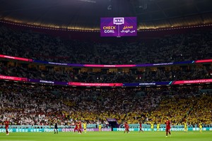 Soccer Football - FIFA World Cup Qatar 2022 - Group A - Qatar v Ecuador - Al Bayt Stadium, Al Khor, Qatar - November 20, 2022
A big screen displays a VAR review message REUTERS/Kai Pfaffenbach