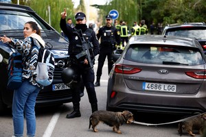 Police stands outside of Ukrainian embassy after, Spanish police said, blast at embassy building injured one employee while handling a letter, in Madrid, Spain November 30, 2022. REUTERS/Juan Medina