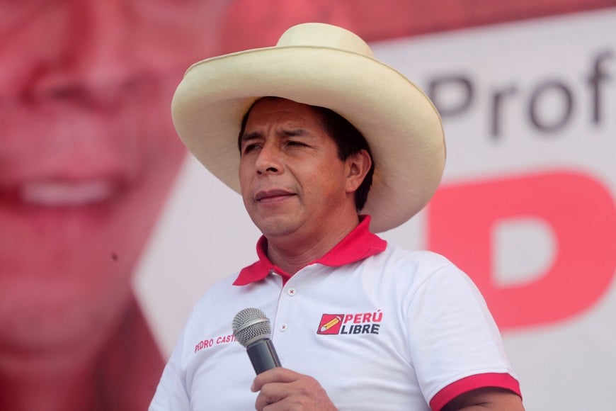 FILE PHOTO: Peru's socialist presidential candidate Pedro Castillo, who will face opponent right-wing candidate Keiko Fujimori in a run-off vote on June 6, addresses supporters at a rally in Lima, Peru May 26, 2021. REUTERS/Sebastian Castaneda/File Photo