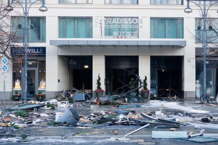 A general view of a street outside a hotel after a leak of the AquaDom aquarium in central Berlin near Alexanderplatz, Germany, December 16, 2022. REUTERS/Michele Tantussi
