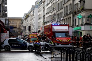 French police and firefighters secure a street after gunshots were fired killing two people and injuring several in a central district of Paris, France, December 23, 2022.  REUTERS/Sarah Meyssonnier