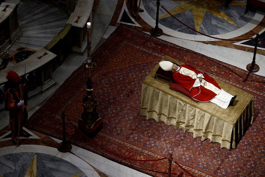 SENSITIVE MATERIAL. THIS IMAGE MAY OFFEND OR DISTURB    Faithful pay homage to former Pope Benedict, as his body lies in state at St. Peter's Basilica, at the Vatican, January 3, 2023. REUTERS/Guglielmo Mangiapane