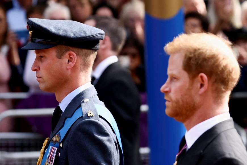 FILE PHOTO: Britain's William, Prince of Wales and Prince Harry march during a procession where the coffin of Britain's Queen Elizabeth is transported from Buckingham Palace to the Houses of Parliament for her lying in state, in London, Britain, September 14, 2022.  REUTERS/Henry Nicholls/Pool/File Photo
