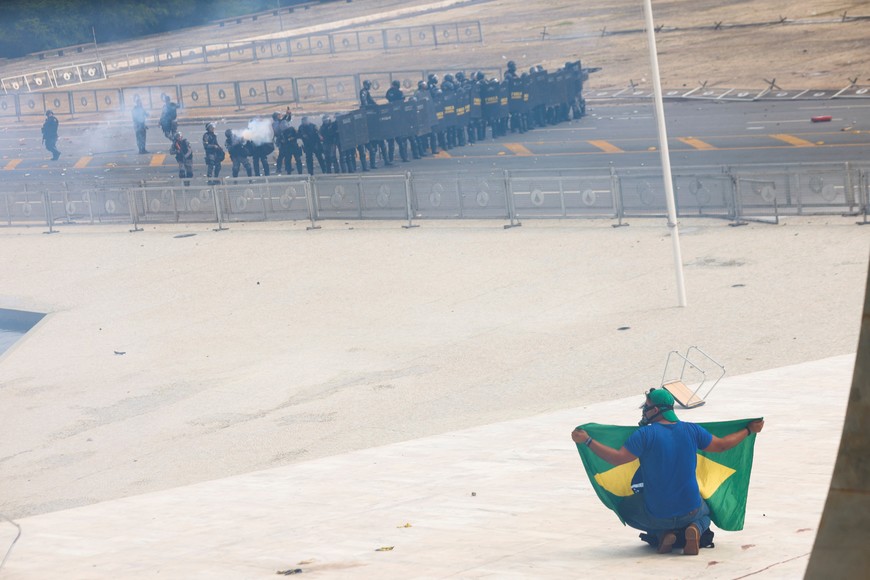 Security forces operate as supporters of Brazil's former President Jair Bolsonaro demonstrate against President Luiz Inacio Lula da Silva, outside Brazil’s National Congress in Brasilia, Brazil, December 8, 2023. REUTERS/Adriano Machado