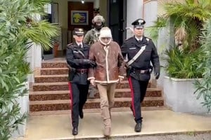 A screengrab taken from a video shows Matteo Messina Denaro the country's most wanted mafia boss being escorted out of a Carabinieri police station after he was arrested in Palermo, Italy, January 16, 2023. Carabinieri/Handout via REUTERS ATTENTION EDITORS THIS IMAGE HAS BEEN SUPPLIED BY A THIRD PARTY.
