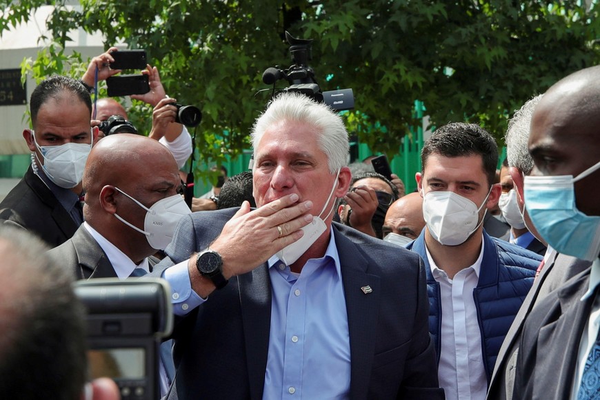 Cuban President Miguel Diaz Canel greets Cuban residents in Mexico, activists and Mexican people in favor of Cuba, outside the Cuban Embassy in Mexico City, Mexico, September 17, 2021. REUTERS/Henry Romero
