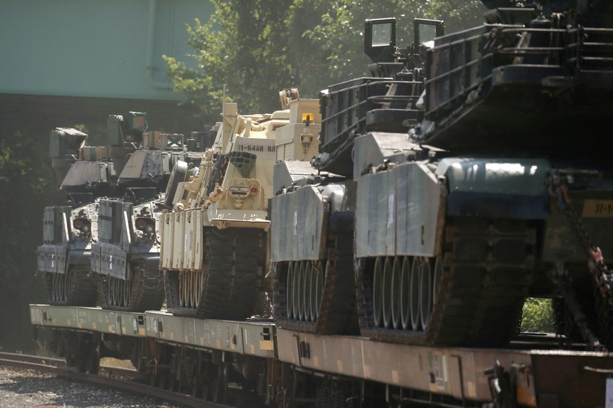 FILE PHOTO: M1 Abrams tanks and other armored vehicles sit atop flat cars in a rail yard after U.S. President Donald Trump said tanks and other military hardware would be part of Fourth of July displays of military prowess in Washington, U.S., July 2, 2019. REUTERS/Leah Millis/File Photo