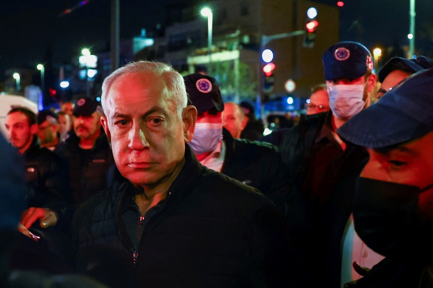 Israeli Prime Minister Benjamin Netanyahu visits the scene of a shooting attack in Neve Yaacov which lies on occupied land that Israel annexed to Jerusalem after the 1967 Middle East war January 27, 2023. REUTERS/Ronen Zvulun