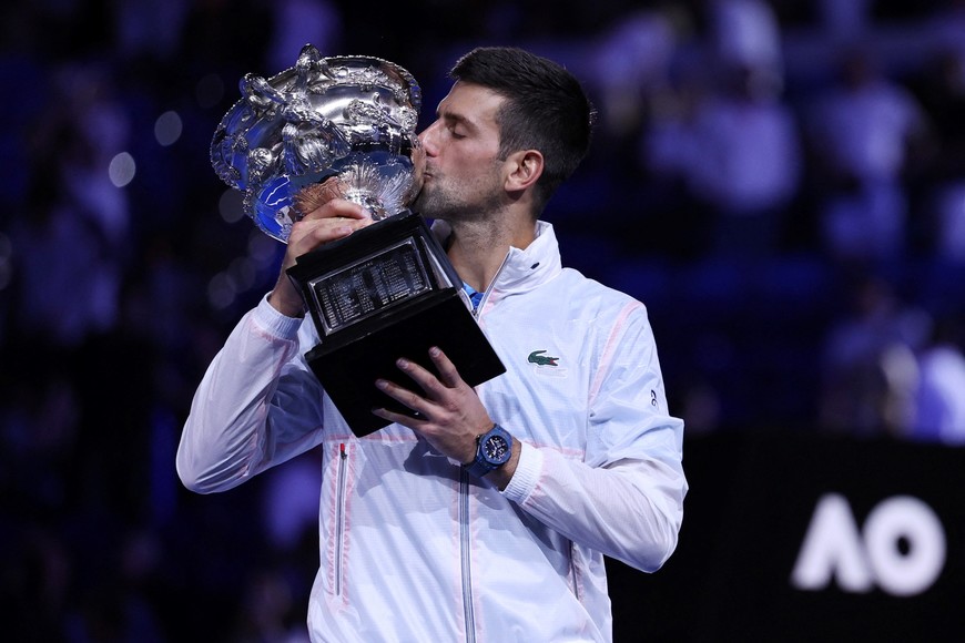 Tennis - Australian Open - Men's Singles Final - Melbourne Park, Melbourne, Australia - January 29, 2023
Serbia's Novak Djokovic celebrates with the trophy after winning his final match against Greece's Stefanos Tsitsipas REUTERS/Loren Elliott
