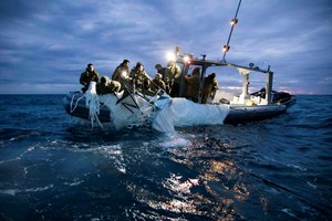 Sailors assigned to Explosive Ordnance Disposal Group 2 recover a suspected Chinese high-altitude surveillance balloon that was downed by the United States over the weekend over U.S. territorial waters off the coast of Myrtle Beach, South Carolina, U.S., February 5, 2023. U.S. Fleet Forces/U.S. Navy photo/Handout via REUTERS     TPX IMAGES OF THE DAY