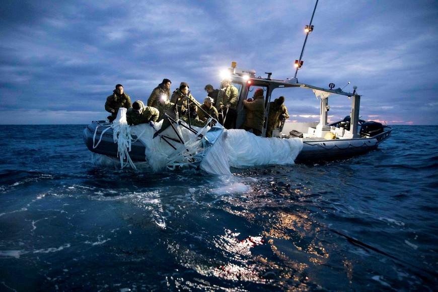 FILE PHOTO: Sailors assigned to Explosive Ordnance Disposal Group 2 recover a suspected Chinese high-altitude surveillance balloon that was downed by the United States over the weekend over U.S. territorial waters off the coast of Myrtle Beach, South Carolina, U.S., February 5, 2023. U.S. Fleet Forces/U.S. Navy photo/Handout/File Photo