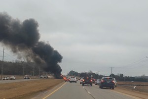 Smoke rises after a helicopter crashed in Harvest, Alabama, U.S., February 15, 2023 in this screen grab obtained from a social media video. Josh Smith State Farm/via REUTERS  THIS IMAGE HAS BEEN SUPPLIED BY A THIRD PARTY. MANDATORY CREDIT. NO RESALES. NO ARCHIVES.