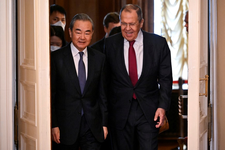 Russia's Foreign Minister Sergei Lavrov and China's Director of the Office of the Central Foreign Affairs Commission Wang Yi enter a hall during a meeting in Moscow, Russia February 22, 2023. Alexander Nemenov/Pool via REUTERS