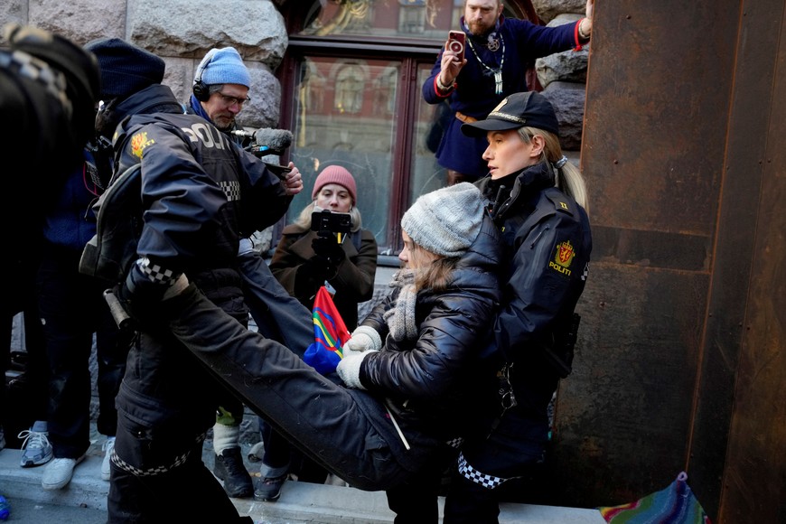Greta Thunberg is carried away by police officers as activits demonstrate outside the Ministry of Finance entrance and several other ministries in protest against the Fosen wind turbines not being demolished, which was built on land traditionally used by indigenous Sami reindeer herders, in Oslo, Norway, March 1, 2023.  Alf Simensen/NTB/via REUTERS   ATTENTION EDITORS - THIS IMAGE WAS PROVIDED BY A THIRD PARTY. NORWAY OUT. NO COMMERCIAL OR EDITORIAL SALES IN NORWAY.
