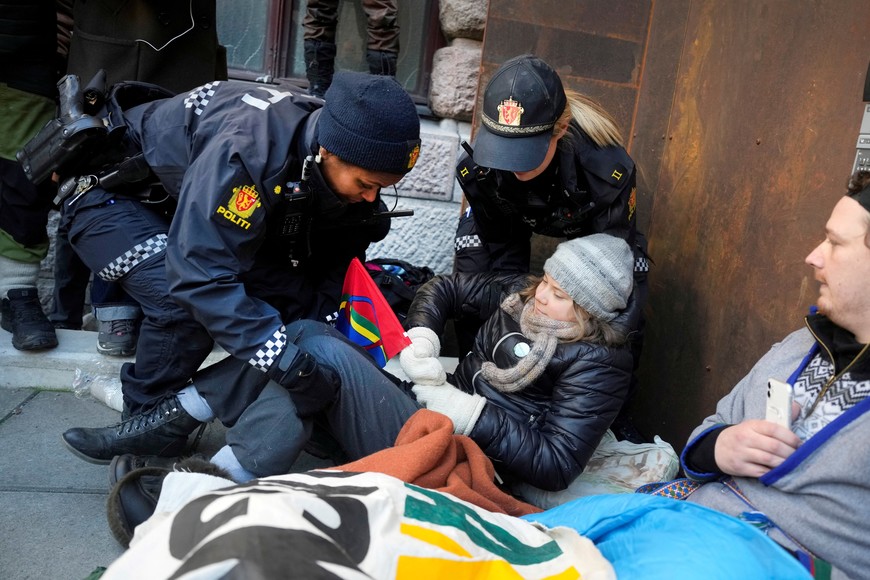 Greta Thunberg is carried away by police officers as activits demonstrate outside the Ministry of Finance entrance and several other ministries in protest against the Fosen wind turbines not being demolished, which was built on land traditionally used by indigenous Sami reindeer herders, in Oslo, Norway, March 1, 2023.  Alf Simensen/NTB/via REUTERS   ATTENTION EDITORS - THIS IMAGE WAS PROVIDED BY A THIRD PARTY. NORWAY OUT. NO COMMERCIAL OR EDITORIAL SALES IN NORWAY.