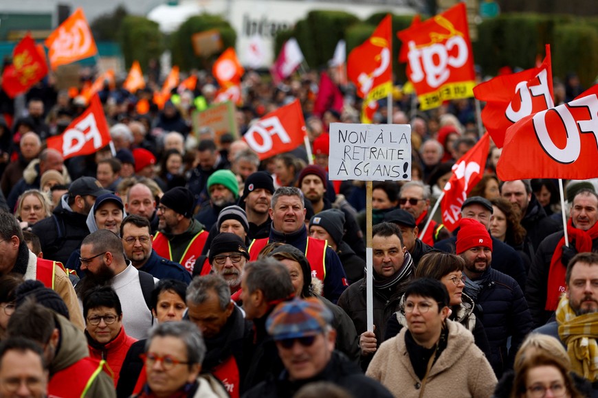 Protesters attend a demonstration against French government's pension reform plan in Pont-Audemer, as part of the sixth day of national strike and protests, in France, March 7, 2023. REUTERS/Gonzalo Fuentes