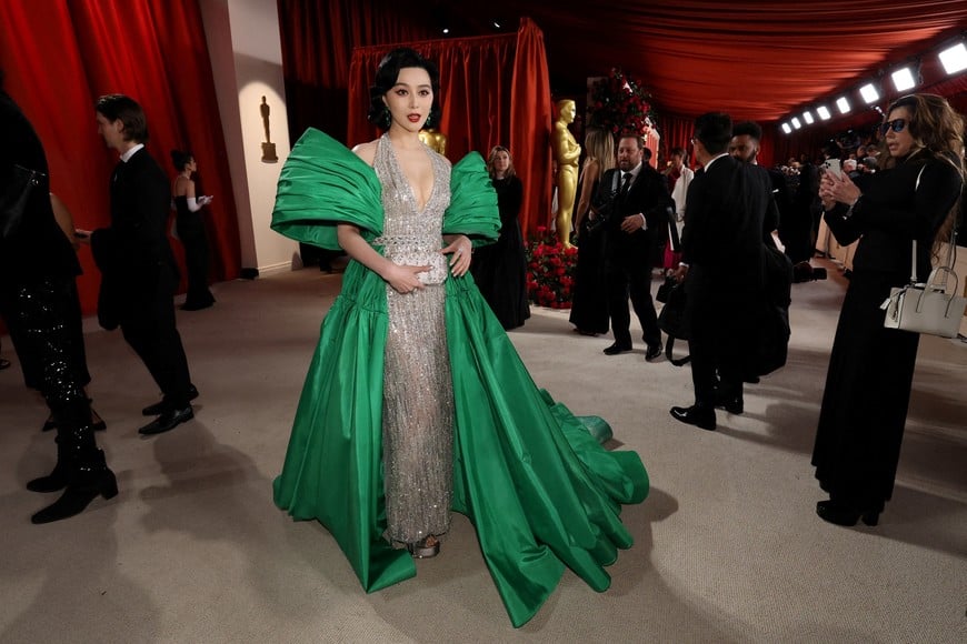 Fan Bingbing poses on the champagne-colored red carpet during the Oscars arrivals at the 95th Academy Awards in Hollywood, Los Angeles, California, U.S., March 12, 2023.   REUTERS/Mario Anzuoni
