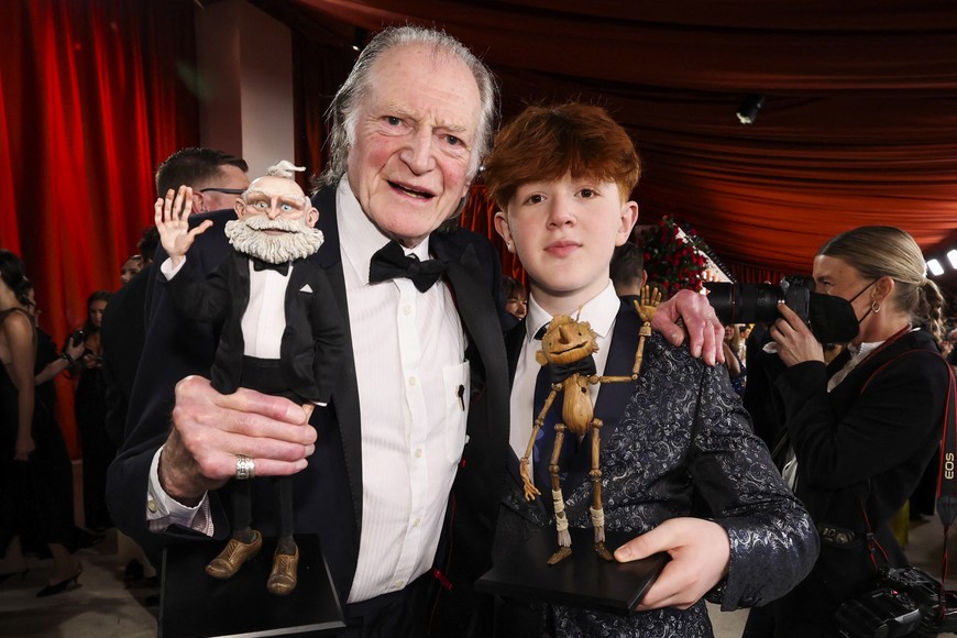 Actors David Bradley and Gregory Mann pose on the champagne-colored red carpet during the Oscars arrivals at the 95th Academy Awards in Hollywood, Los Angeles, California, U.S., March 12, 2023. REUTERS/Mario Anzuoni
