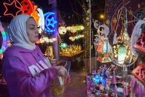 A woman looks at decorations for the holy month of Ramadan in Amman, Jordan, March 22, 2023. REUTERS/Muath Freij
