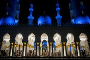 Muslim women offer 'Tarawih' mass prayers during the first evening of the holy fasting month of Ramadan at Sheikh Zayed Grand mosque in Solo, Central Java province, Indonesia, March 22, 2023, in this photo taken by Antara Foto. Antara Foto/Mohammad Ayudha/ via REUTERS ATTENTION EDITORS - THIS IMAGE HAS BEEN SUPPLIED BY A THIRD PARTY. MANDATORY CREDIT. INDONESIA OUT. NO COMMERCIAL OR EDITORIAL SALES IN INDONESIA.