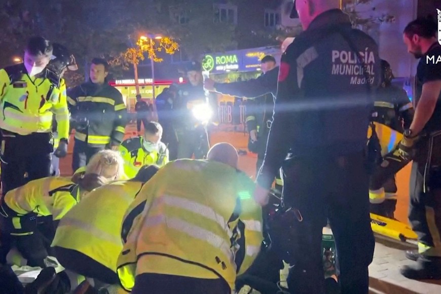 Rescuers work outside a restaurant following a fire, in Madrid, Spain, April 21, 2023, in this screen grab taken from a handout video. Madrid Emergency Service/Handout via REUTERS  THIS IMAGE HAS BEEN SUPPLIED BY A THIRD PARTY.
