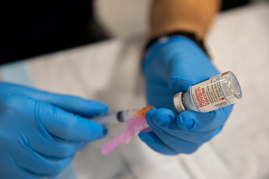 A healthcare worker prepares a dose of the Moderna Covid-19 vaccine at Queens Police Academy in the Queens borough of New York, U.S., January 11, 2021. Jeenah Moon/Pool via REUTERS