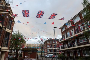 Flags adorn the Kirby Estate in Bermondsey, South London, in preparation for the Britain's King Charles and Camilla, Queen Consort's coronation, in London, Britain May 5, 2023. REUTERS/Emilie Madi