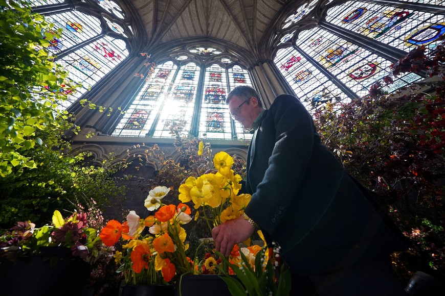 Florist Shane Connolly stands next to flowers, which some of them will be used at Westminster Abbey for the Coronation of King Charles and Camilla, Queen Consort, in London, Britain May 4, 2023. Yui Mok/Pool via REUTERS
