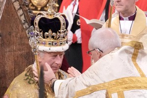 King Charles III receives The St Edward's Crown during his coronation ceremony in Westminster Abbey, London. Picture date: Saturday May 6, 2023.  Jonathan Brady/Pool via REUTERS