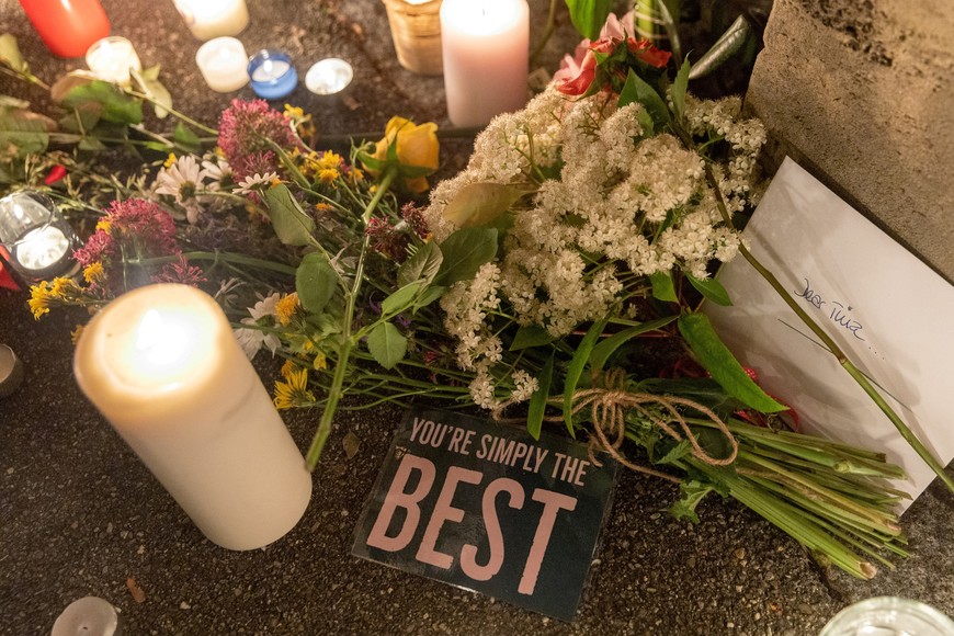 Flowers and candles are pictured in front of the home of Tina Tuner in Kuesnacht near Zurich, Switzerland May 25, 2023.  REUTERS/Denis Balibouse