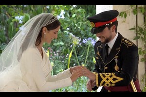 Jordan's Crown Prince Hussein and Rajwa Al Saif exchange rings at their royal wedding ceremony, in Amman, Jordan, June 1, 2023 in this screen grab taken from a video. Royal Hashemite Court (RHC)/Handout via REUTERS ATTENTION EDITORS - THIS IMAGE WAS PROVIDED BY A THIRD PARTY. NO RESALES. NO ARCHIVES.