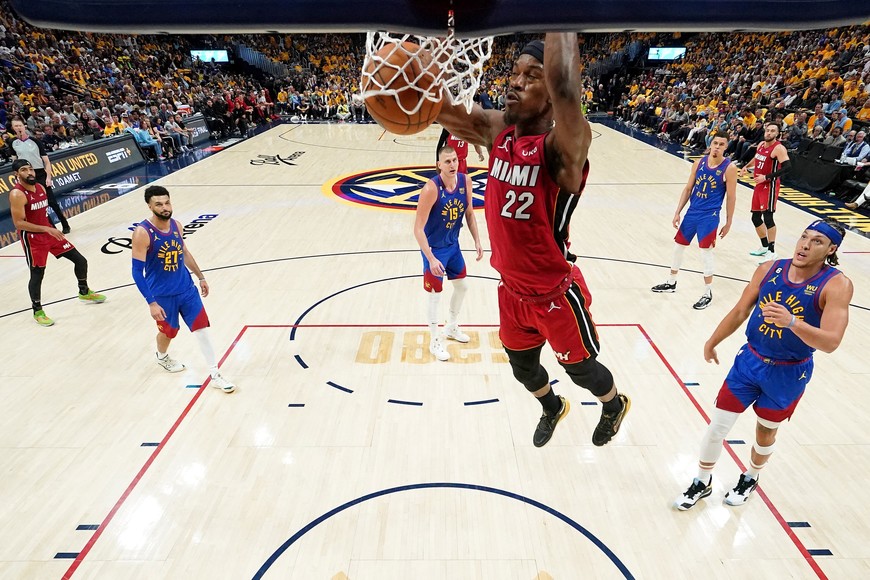 Jun 1, 2023; Denver, CO, USA; Miami Heat forward Jimmy Butler (22) dunks against the Denver Nuggets during the second half in game one of the 2023 NBA Finals at Ball Arena. Mandatory Credit: Kyle Terada-USA TODAY Sports