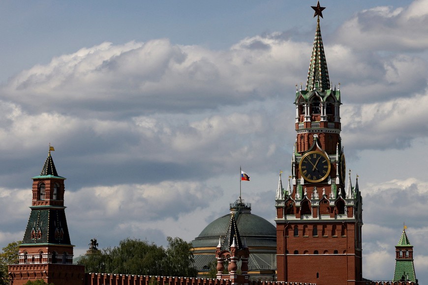 FILE PHOTO: The Russian flag flies on the dome of the Kremlin Senate building behind Spasskaya Tower, in central Moscow, Russia, May 4, 2023. REUTERS/Stringer/File Photo
