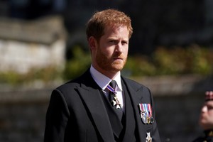 Britain's Prince Harry walking in the procession at Windsor Castle, Berkshire, during the funeral of Britain's Prince Philip, who died at the age of 99, Britain, April 17, 2021. Victoria Jones/Pool via REUTERS