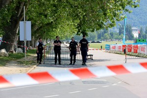 French police secure the area after several children and an adult have been injured in a knife attack in Annecy, in the French Alps, France, June 8, 2023. REUTERS/Denis Balibouse