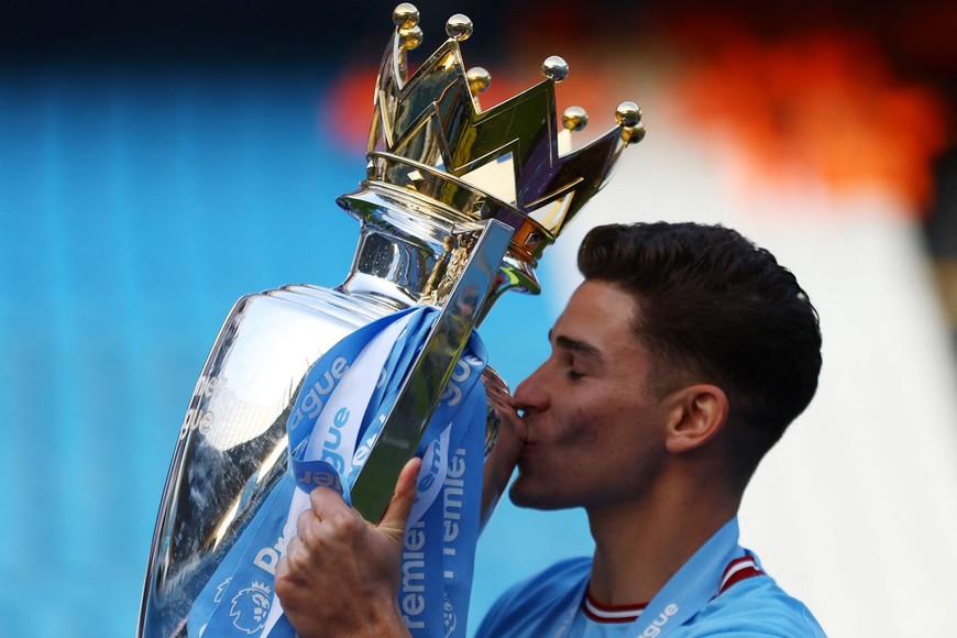 Soccer Football - Premier League - Manchester City v Chelsea - Etihad Stadium, Manchester, Britain - May 21, 2023
Manchester City's Julian Alvarez celebrates with the trophy after winning the Premier League Action Images via Reuters/Lee Smith EDITORIAL USE ONLY. No use with unauthorized audio, video, data, fixture lists, club/league logos or 'live' services. Online in-match use limited to 75 images, no video emulation. No use in betting, games or single club	/league/player publications.  Please contact your account representative for further details.