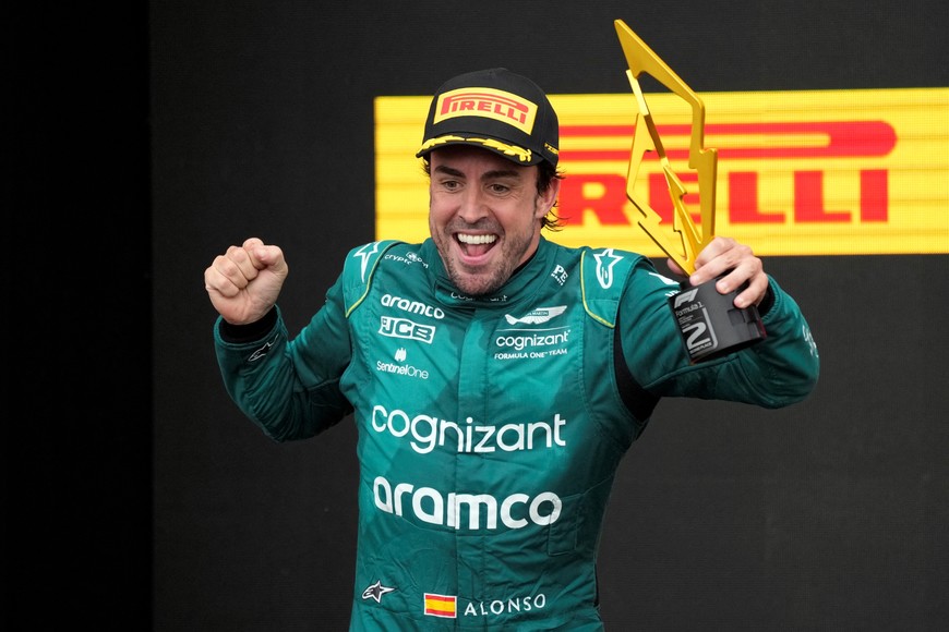 Formula One F1 - Canadian Grand Prix - Circuit Gilles Villeneuve, Montreal, Canada - June 18, 2023
Aston Martin's Fernando Alonso celebrates with a trophy on the podium after finishing the race in second place REUTERS/Mathieu Belanger