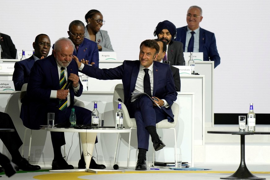 French President Emmanuel Macron gestures toward Brazilian President Luiz Inacio Lula Da Silva, left, during the closing session of the New Global Financial Pact Summit, Friday, June 23, 2023 in Paris, France. The aim of the two-day climate and finance summit was to set up concrete measures to help poor and developing countries whose predicaments have been worsened by the devastating effects of the COVID-19 pandemic and the war in Ukraine better tackle poverty and climate change.     Lewis Joly/Pool via REUTERS
