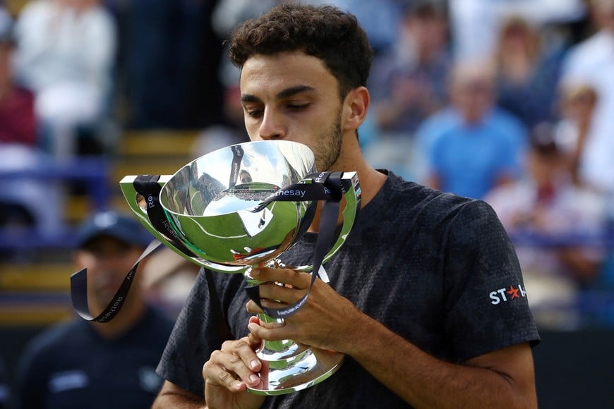 Tennis - Eastbourne International - Devonshire Park Lawn Tennis Club, Eastbourne, Britain - July 1, 2023
Argentina's Francisco Cerundolo celebrates with the trophy after winning his final match against Tommy Paul of the U.S. Action Images via Reuters/Paul Childs