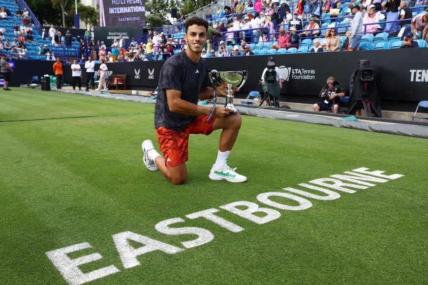 Tennis - Eastbourne International - Devonshire Park Lawn Tennis Club, Eastbourne, Britain - July 1, 2023
Argentina's Francisco Cerundolo celebrates with the trophy after winning his final match against Tommy Paul of the U.S. Action Images via Reuters/Paul Childs