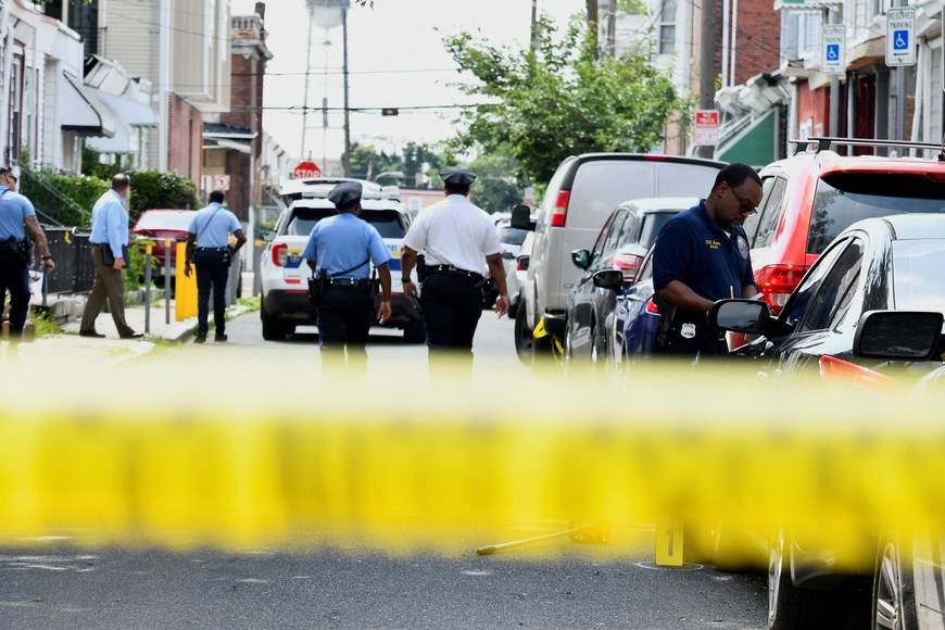 Police officers work at the scene as investigations are ongoing the day after a mass shooting in the Kingsessing section of southwest Philadelphia, Pennsylvania, U.S. July 4, 2023.  REUTERS/Bastiaan Slabbers