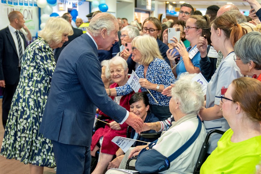 King Charles III and Queen Camilla meet staff and patients during a visit to the Royal Infirmary of Edinburgh, Scotland, Britain, to celebrate 75 years of the NHS at NHS Lothian, as part of the first Holyrood Week since his coronation. Picture date: Tuesday July 4, 2023. Jane Barlow/Pool via REUTERS