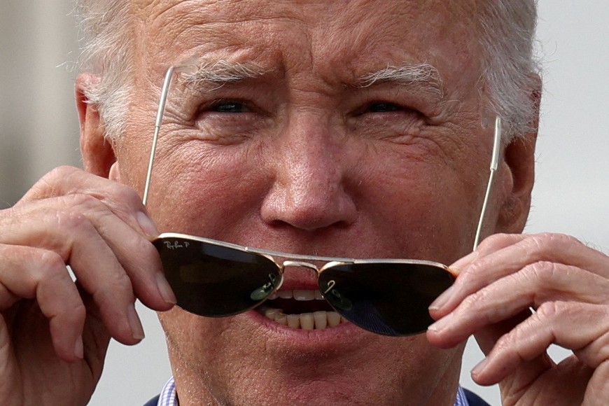 U.S. President Joe Biden adjusts his sunglasses while speaking at a barbecue with active-duty military families on the South Lawn at the White House in Washington, U.S., July 4, 2023. REUTERS/Julia Nikhinson     TPX IMAGES OF THE DAY