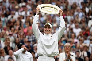 Tennis - Wimbledon - All England Lawn Tennis and Croquet Club, London, Britain - July 15, 2023
Czech Republic's Marketa Vondrousova celebrates with the trophy winning her final match against Tunisia’s Ons Jabeur REUTERS/Dylan Martinez